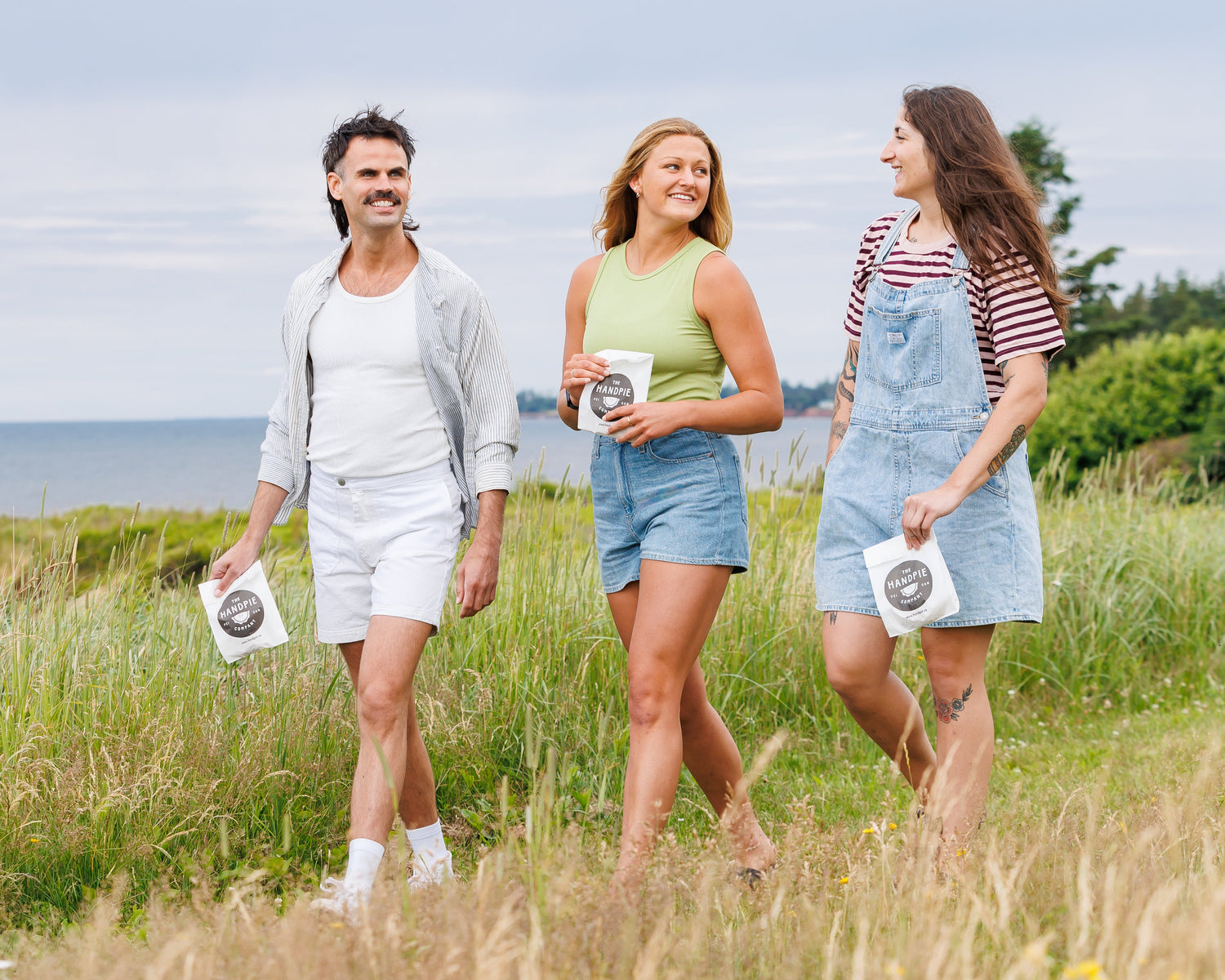 Three friends looking for things to do in PEI bring their handpies to the beach to hang out and enjoy together